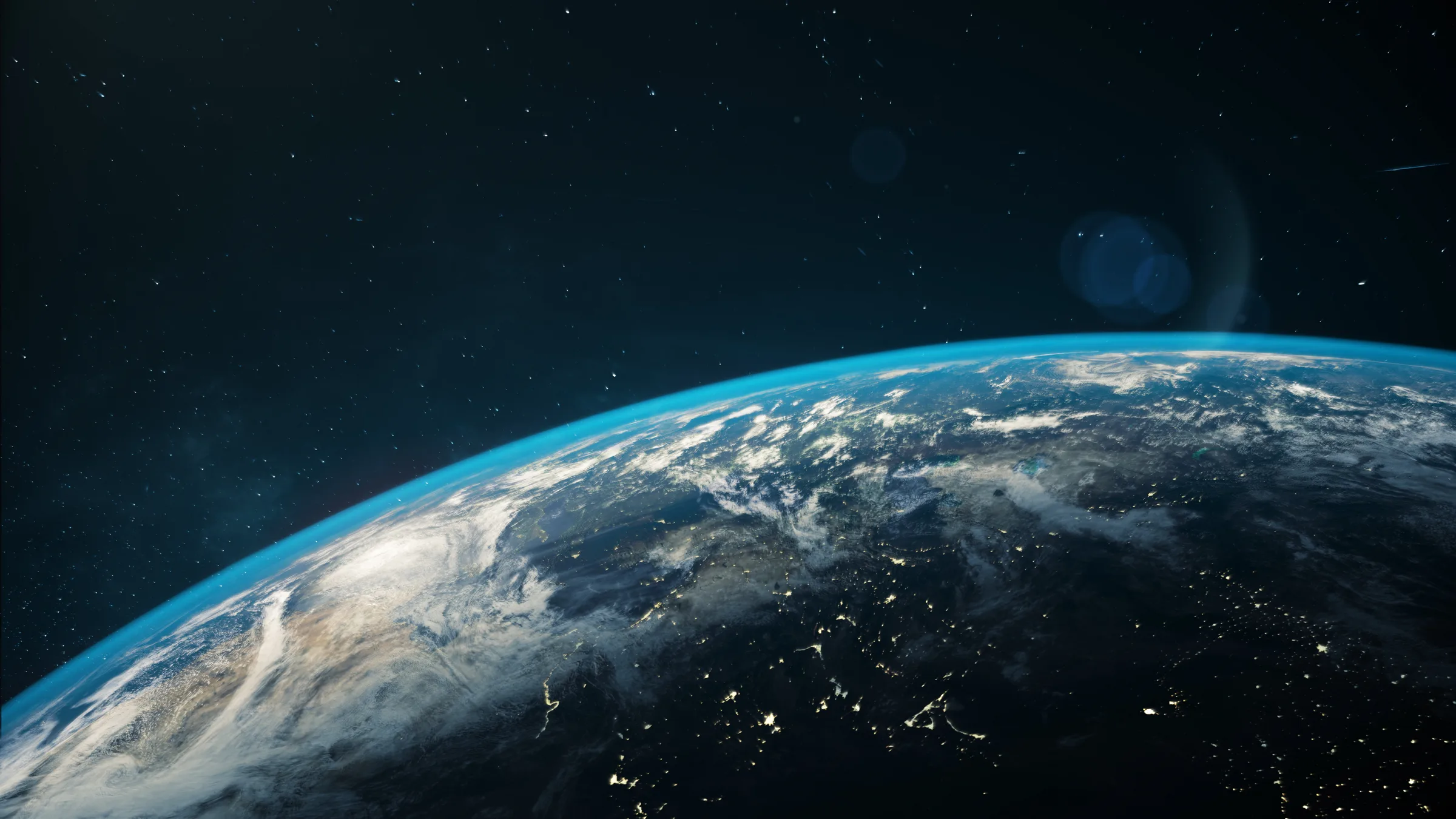 Earth viewed from space with clouds over the curved horizon